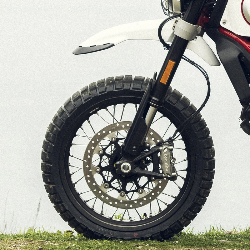 Image of 4 pot disc brake on front wheel of Ducati motorcycle