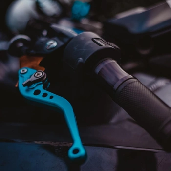 A motorcycle clutch lever in blue color