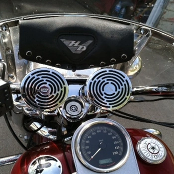 Image of motorcycle handlebar fitted with bluetooth speaker