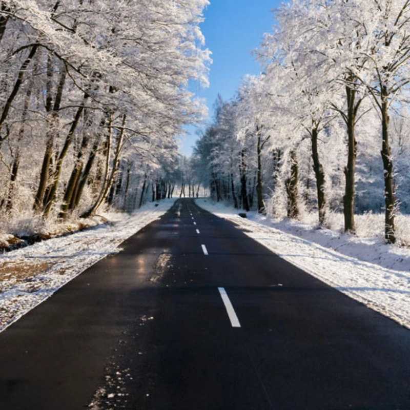 Image of black ice formed on the road in winter