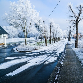 Image of ice and snow on road while snow motorcycling
