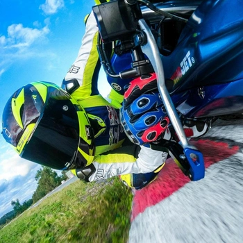 Image of a motorcyclist knee dragging shooting on action-camera