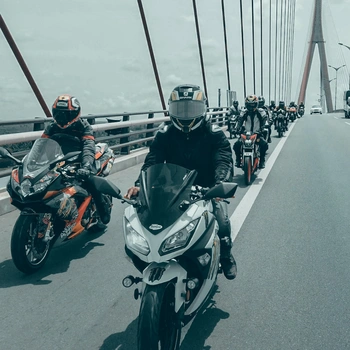 Image of group of bikers having different body postures on the motorcycle
