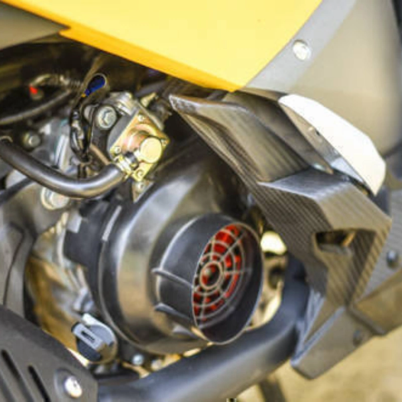 Image of fan cooling based engine on yellow TVS ntorq 125cc scooter